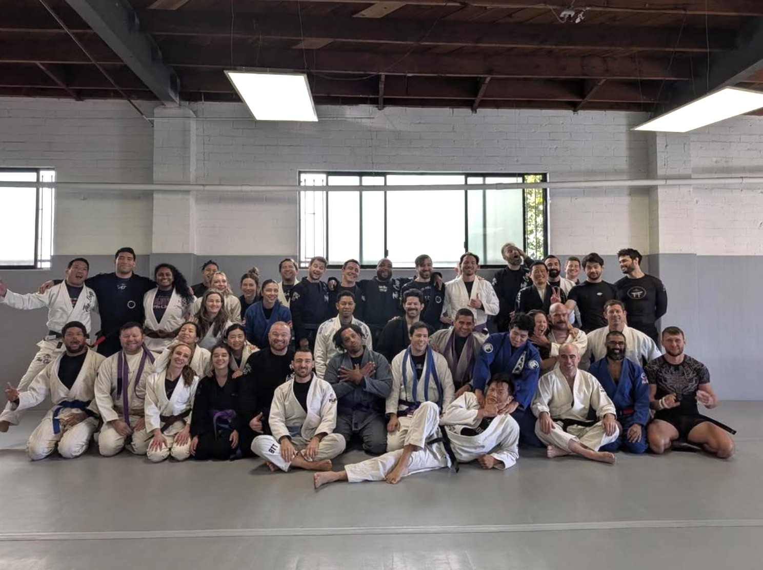 The full Coop community — around 45 members under the warehouse ceiling